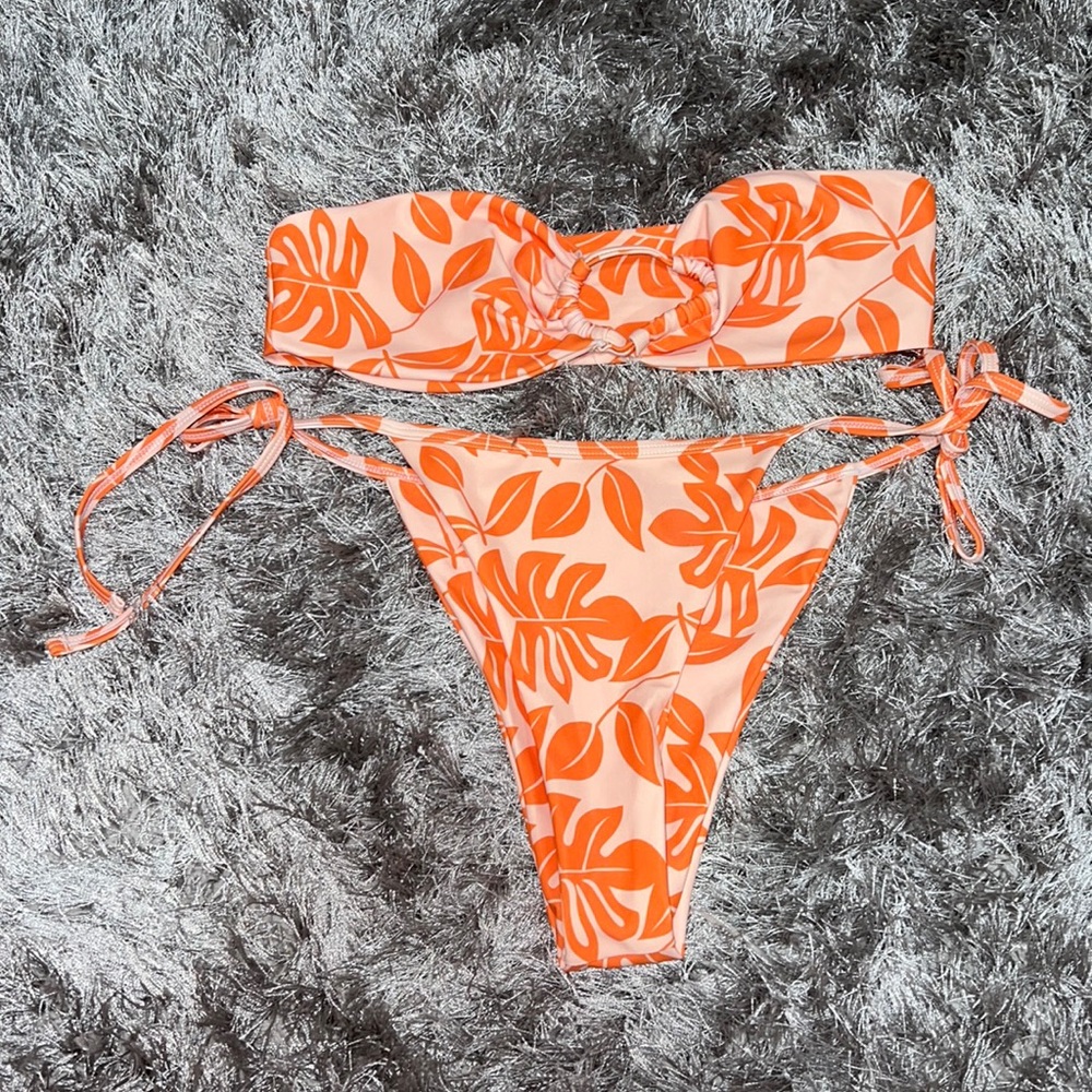 Orange design strapless string bikini. Size medium.